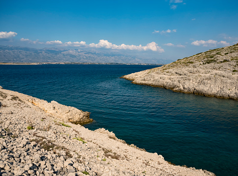 Mala rasovaca bay near the city of vrsi in Croatia with Velebit Mountains