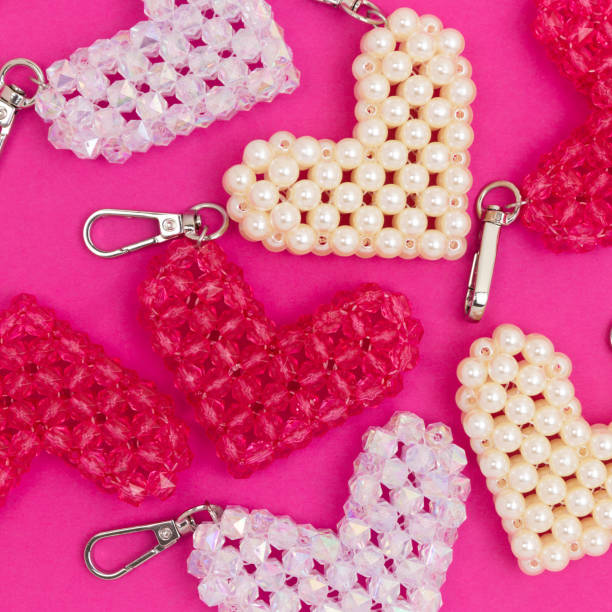 istock Different handmade keychains in a heart shape made from acrylic beads. 2028212189