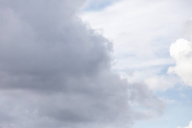 Nature background abstract photo of the beauty of the sky adorned with white, billowing cumulus clouds, creating an abstract texture against the vast expanse of bright blue. This panoramic view offers a captivating angle, showcasing the ethereal dance of clouds amidst the boundless sky. Immerse yourself in the tranquility of nature's canvas, where the interplay of light and shadow creates an ever-changing spectacle of wonder