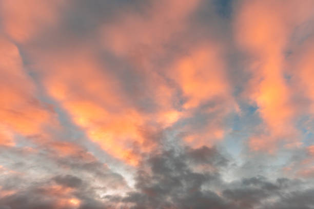Backgrounds of colourful and beautiful sunset / sunrise with clouds with sunlight on dramatic sky texture