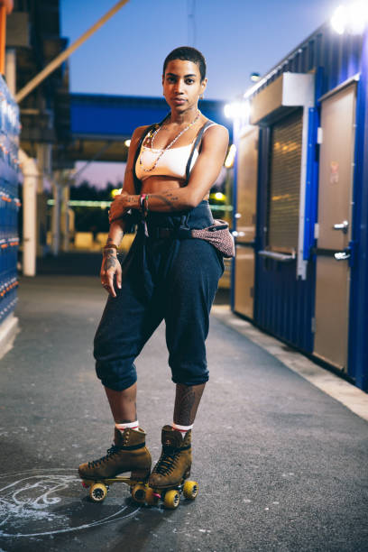 istock Woman with quad skates looking at camera 2028236022