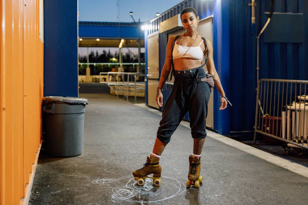 istock Woman with quad skates looking at camera 2028237112