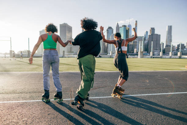 istock Friends on quad roller skates enjoying dancing together 2028289545