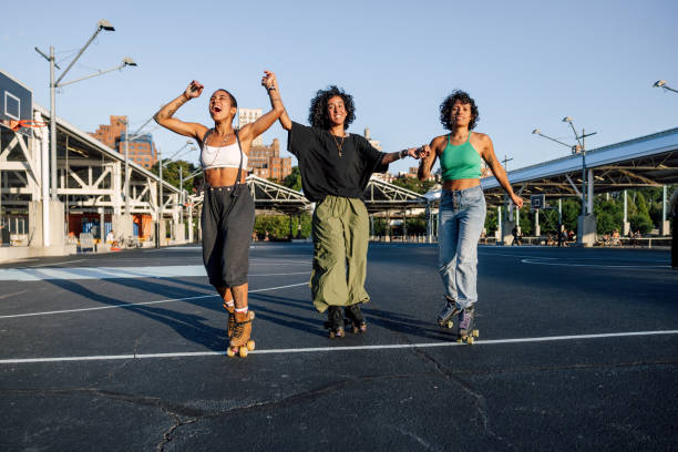 istock Friends on quad roller skates enjoying dancing together 2028292745