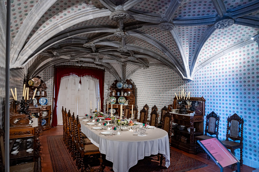 Sintra, Portugal - Oct. 3, 2023: Dinning room in the Pena Palace - Palácio Nacional da Pena, Sintra, Portugal.