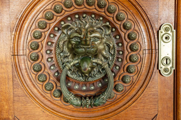 A metal piece shaped like a lion's head