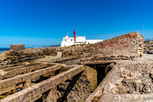 Cascais, Portugal - Oct. 4, 2023: Coastline view of Cabo Raso Lighthouse - Farol do Cabo Raso, Cascais, Portugal.