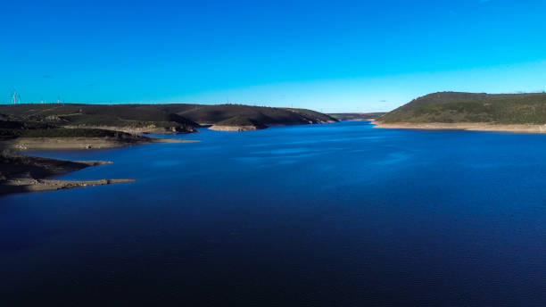 Aerial view of the Ricobayo reservoir in the province of Zamora, where you can see the level of water flow - Ricobayo de Alba , Castilla y León - Spain