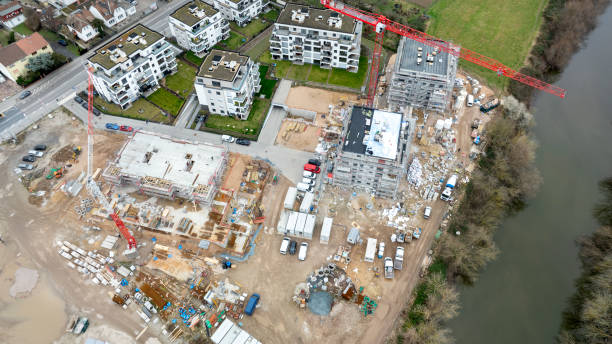 istock Large construction site, cranes and equipment - aerial view 2028316710