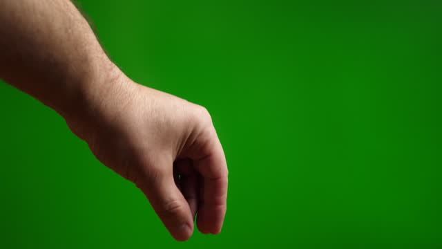 Fingers grab and raise on a green background.