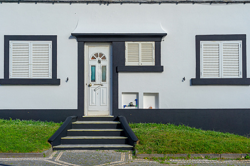 facade of a typical white house with black stripes in Ponta Delgada-São Miguel-Açores-Portugal.