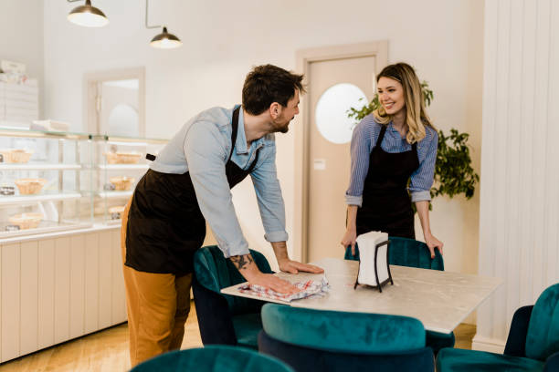 istock The waiters adjusting the chairs and preparing the bar 2028340195