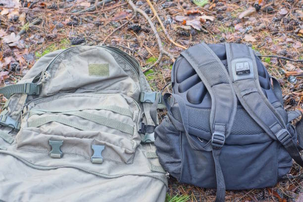 istock two large black and green backpacks lie on the ground 2028346995
