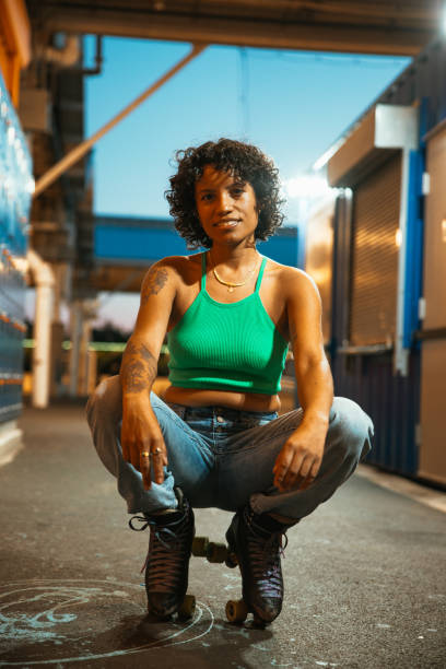 istock Woman with quad skates looking at camera 2028352690
