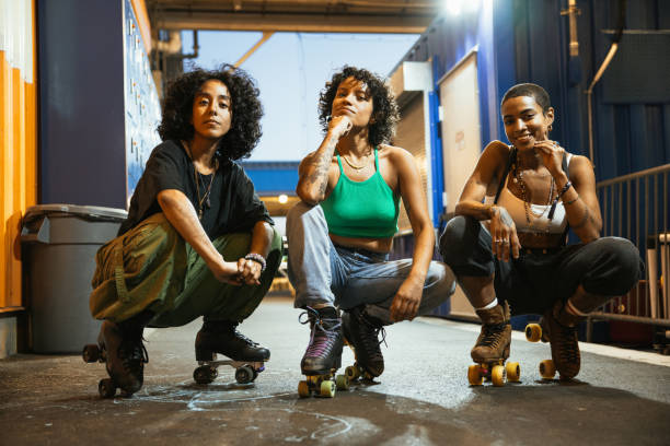Team with quad skates looking at camera