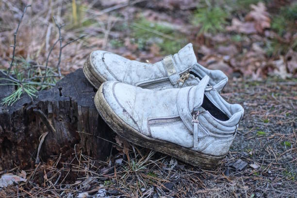 istock two old leather white leather dirty shoes 2028355817