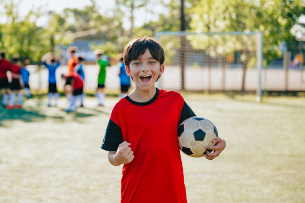 istock portrait of cheering soccer boy 2028365357