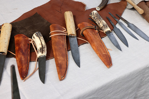 Cracow, Poland - April 11, 2023: Handmade imitations of medieval knives in knight camp at the festival of historical reconstruction