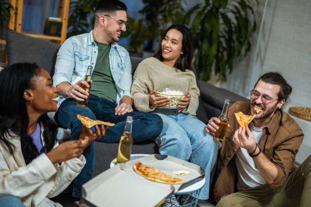 istock Multiracial group of friends having pizza party. 2028430756