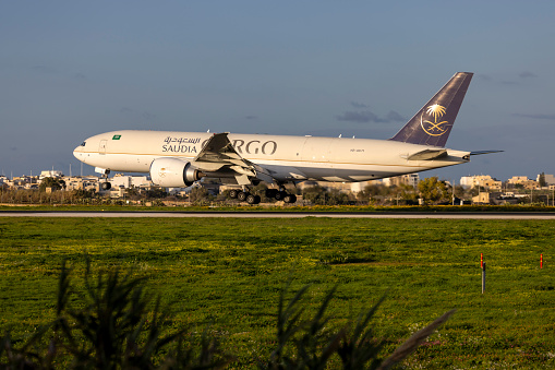Luqa, Malta - February 13, 2024: Saudia - Saudi Arabian Airlines Cargo Boeing 777-FFG (REG: HZ-AK71) arriving directly from Saudi Arabia.