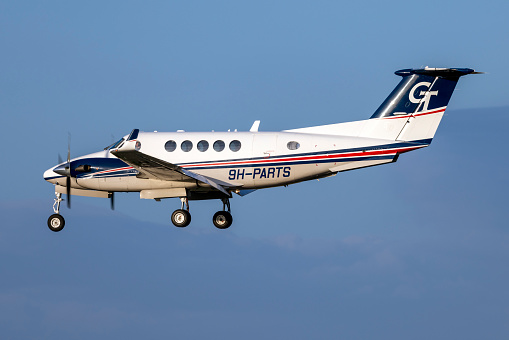 Luqa, Malta - February 13, 2024: VistaJet Malta Beechcraft B200GT Super King Air (REG: 9H-PARTS) landing runway 31 in the evening.