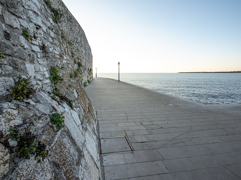 promenade along the sea in city Porec, Croatia