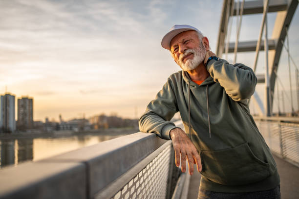istock Senior Caucasian athlete has neck pain 2028497544