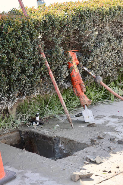 istock Maintenance worker removed concrete to make underground repairs 2028501878