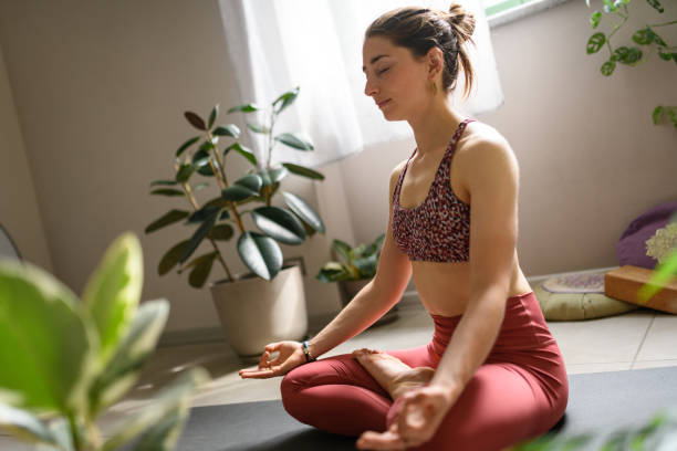 istock Woman practicing yoga at home 2028541747