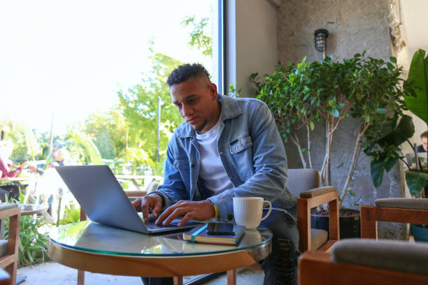 istock Freelancer with laptop at the coffee place. 2028545396