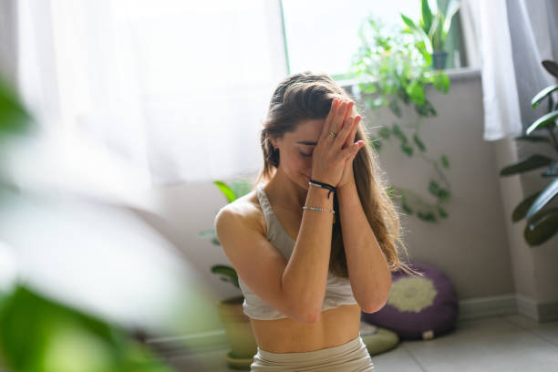 istock Woman practicing yoga at home 2028545414