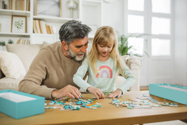 istock Little girl playing with grandfather 2028598044