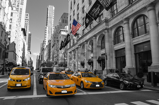 Picture of a few yellow taxi in the street of NYC
