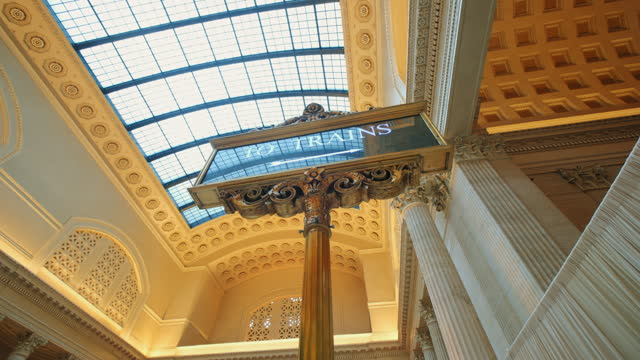 To Trains sign in interior of the waiting hall of Union Station, Chicago, Illinois. Move camera