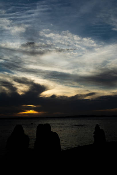 istock Dramatic sunset with dark clouds and sky in yellow and blue color. 2028659626
