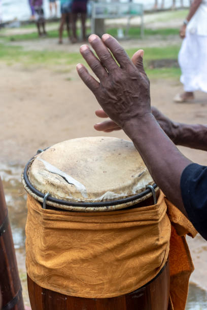 istock Hands of a percussionist playing atabaque at a religious event. 2028659636