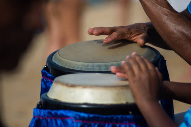 istock Hands playing atabaque. musical rhythm. African music. 2028666456