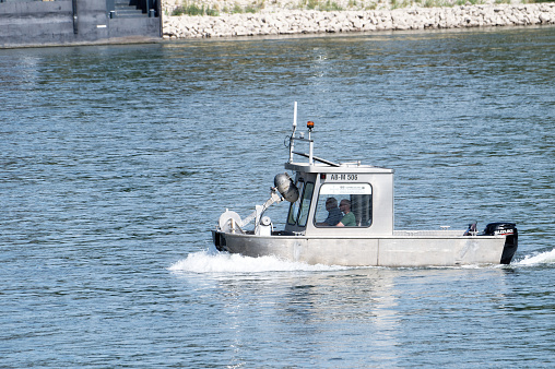 Cologne, Germany July 17 2023: a small survey boat from IBS sails on the rhine near cologne