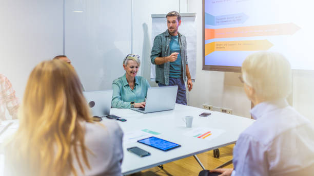 istock Man giving presentation in meeting room 2028849446