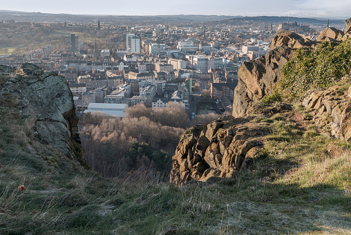 Edinburgh, Scotland - Jan 17, 2024 - Amazing Edinburgh Cityscape seen from the top of Salisbury Crags. Destinations in Europe, Space for text, Selective focus.