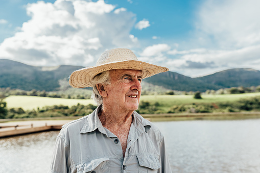 Farmer and dam in the background