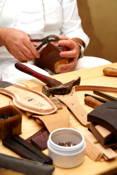 istock Cobbler tools, cobbler concept, cobbler work table, set of leather craft tools on wooden background 2028997741