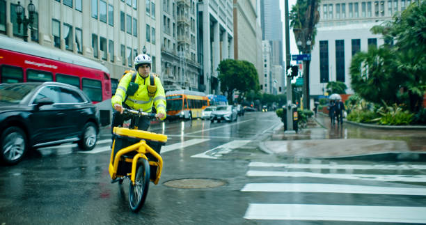 istock Cargo Delivery Person Turning at Intersection in DTLA on Rainy Day 2029006730
