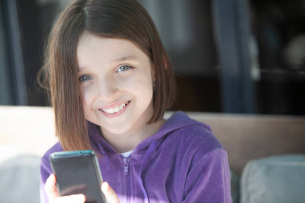 Happy girl smiling with mobile phone