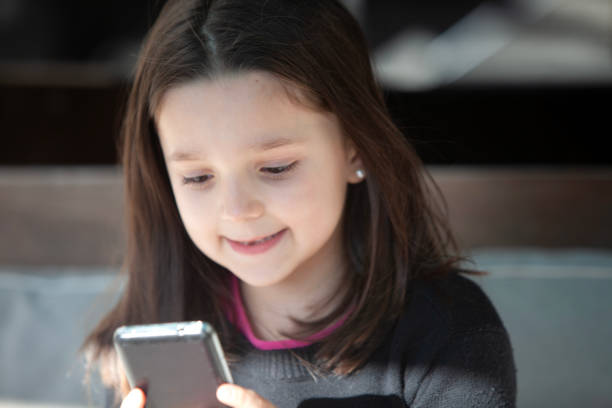 Happy girl smiling with mobile phone