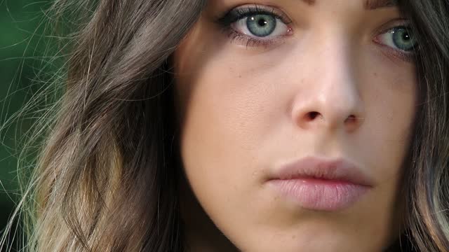 View of beautiful girl with blue eyes: closeup portrait