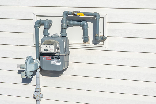 Calgary, Alberta, Canada. Feb 17, 2024. A Home Natural Gas Meter. Specialized flow meter, used to measure the volume of fuel gases such as natural gas and liquefied petroleum gas.