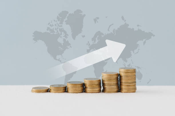 istock stack of  coins with rising arrow on world map background for inflation, financial concepts ,financial investment business stock growth 2029129977