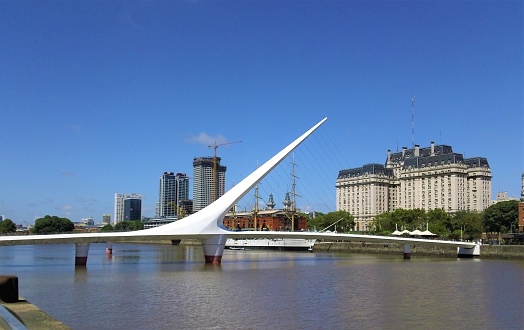 Buenos Aires, Argentina . 02/17/2024 Cityscape of Puerto Madero . The Woman´s Bridge (Puente de la Mujer) designed by the Spanish architect Santiago Calatrava.