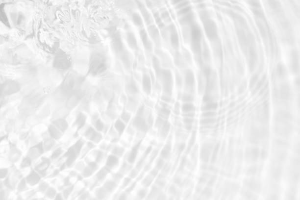 istock White water surface texture with ripples, splashes, and bubbles. Abstract summer banner background Water waves in sunlight with copy space cosmetic moisturizer micellar toner emulsion. White water. 2029155791